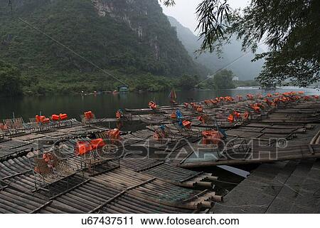 Stock Image - Bamboo rafts in the Yulong River, Yangshuo, Guilin, Guangxi Province, China. Fotosearch