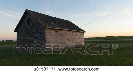 Stock Image - Barn in a prairie field, Manitoba, Canada. Fotosearch