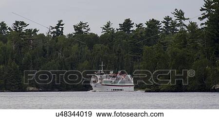 Boat in a Lake Of The Woods, Keewatin, Ontario, Canada View Large Photo Image Stock Photo - Boat in a Lake Of The Woods, Keewatin, Ontario, Canada. Fotosearch