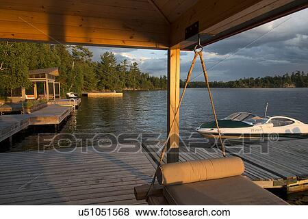 Boats at a dock, Lake of The Woods, Keewatin, Ontario, Canada View Large Photo Image Stock Photo - Boats at a dock, Lake of The Woods, Keewatin, Ontario, Canada. Fotosearch