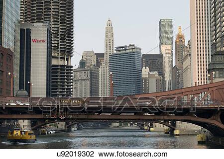 Stock Image - Buildings at the waterfront, Merchandise Mart Conference Hall, Westin Michigan Avenue Chicago, Chicago River, Chicago, Cook County, Illinois, USA. Fotosearch