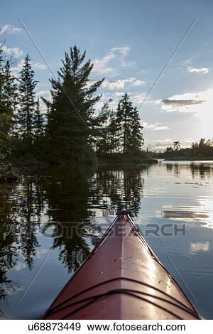 Canoe in a lake, Lake of The Woods, Keewatin, Ontario, Canada View Large Photo Image Stock Photo - Canoe in a lake, Lake of The Woods, Keewatin, Ontario, Canada. Fotosearch