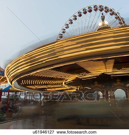Carousel lights spinning at dusk, Navy Pier Park, Navy Pier, Chicago, Cook County, Illinois, USA View Large Photo Image Stock Photo - Carousel lights spinning at dusk, Navy Pier Park, Navy Pier, Chicago, Cook County, Illinois, USA. Fotosearch