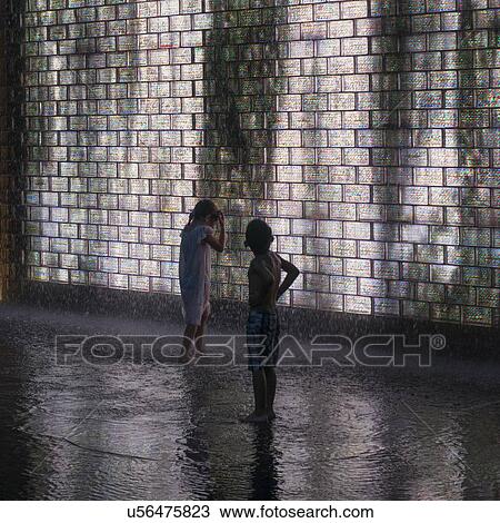 Children under Crown Fountain, Millennium Park, E Monroe Street, Chicago, Cook County, Illinois, USA View Large Photo Image Stock Image - Children under Crown Fountain, Millennium Park, E Monroe Street, Chicago, Cook County, Illinois, USA. Fotosearch