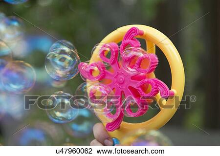 Stock Image - Close-up of a bubble wand, Lake of The Woods, Keewatin, Ontario, Canada. Fotosearch
