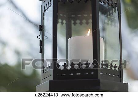 Stock Image - Close-up of a candle glowing lantern, Lake of The Woods, Keewatin, Ontario, Canada. Fotosearch