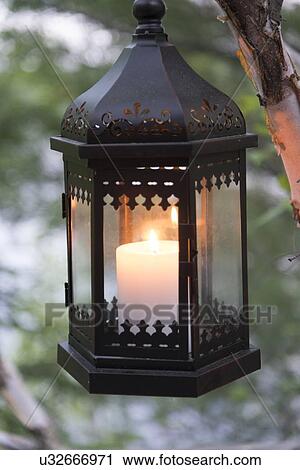 Stock Image - Close-up of a candle glowing lantern, Lake of The Woods, Keewatin, Ontario, Canada. Fotosearch