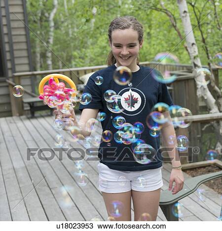 Close-up of a girl playing with bubbles, Lake of The Woods, Keewatin, Ontario, Canada View Large Photo Image Stock Image - Close-up of a girl playing with bubbles, Lake of The Woods, Keewatin, Ontario, Canada. Fotosearch