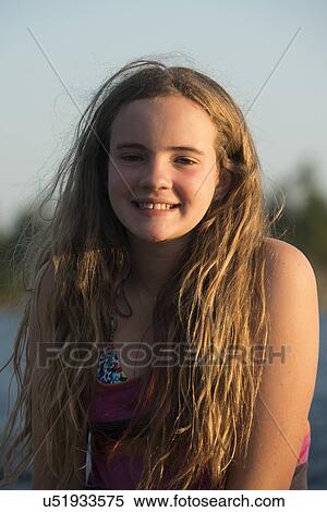 Stock Photography - Close-up of a girl smiling, Lake of The Woods, Keewatin, Ontario, Canada. Fotosearch