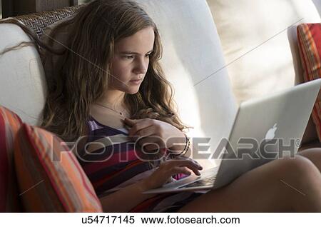 Close-up of a girl using a laptop, Lake of The Woods, Keewatin, Ontario, Canada View Large Photo Image Stock Photography - Close-up of a girl using a laptop, Lake of The Woods, Keewatin, Ontario, Canada. Fotosearch
