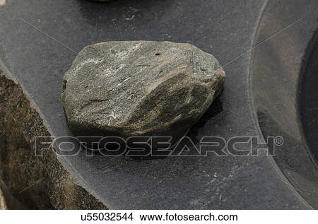 Picture - Close-up of a stone with birdbath, Lake of The Woods, Keewatin, Ontario, Canada. Fotosearch