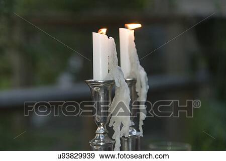 Stock Photo - Close-up of burning candles on stand, Lake of The Woods, Keewatin, Ontario, Canada. Fotosearch