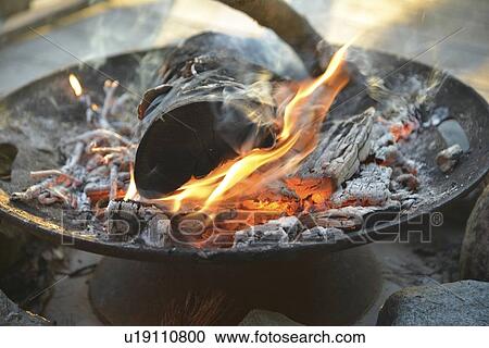 Stock Image - Close-up of campfire, Lake of The Woods, Keewatin, Ontario, Canada. Fotosearch