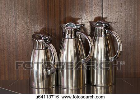 Close-up of three jugs on a kitchen counter View Large Photo Image Stock Photograph - Close-up of three jugs on a kitchen counter. Fotosearch
