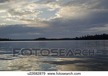 Clouds over Lake of The Woods, Keewatin, Ontario, Canada View Large Photo Image Stock Photo - Clouds over Lake of The Woods, Keewatin, Ontario, Canada. Fotosearch