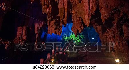 Display of colorful lights in a cave, Assembling Dragon Cave, Yangshuo, Guilin, Guangxi Province, China View Large Photo Image Stock Photo - Display of colorful lights in a cave, Assembling Dragon Cave, Yangshuo, Guilin, Guangxi Province, China. Fotosearch