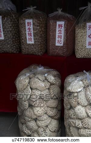 Stock Image - Display of sacks of food for sale, Fuli Village, Yangshuo, Guilin, Guangxi Province, China. Fotosearch