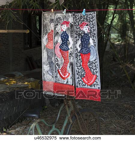 Stock Photography - Display of traditional paintings hanging by clothespin, Xingping, Yangshuo, Guilin, Guangxi Province, China. Fotosearch