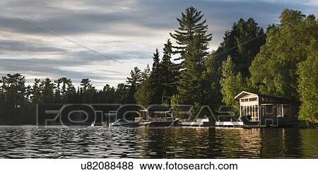 Dock at a lake, Lake Of The Woods, Keewatin, Ontario, Canada View Large Photo Image Stock Photo - Dock at a lake, Lake Of The Woods, Keewatin, Ontario, Canada. Fotosearch