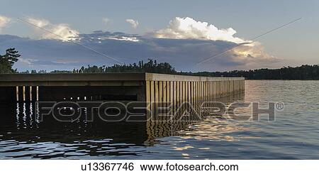 Dock at a lake, Lake Of The Woods, Keewatin, Ontario, Canada View Large Photo Image Stock Photograph - Dock at a lake, Lake Of The Woods, Keewatin, Ontario, Canada. Fotosearch