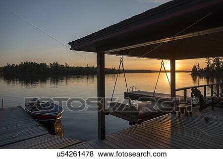 Dock at Lake of The Woods at sunset, Keewatin, Ontario, Canada View Large Photo Image Stock Photo - Dock at Lake of The Woods at sunset, Keewatin, Ontario, Canada. Fotosearch
