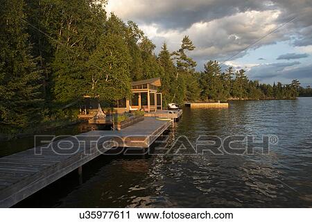 Dock at the lakeside, Lake of The Woods, Keewatin, Ontario, Canada View Large Photo Image Stock Image - Dock at the lakeside, Lake of The Woods, Keewatin, Ontario, Canada. Fotosearch