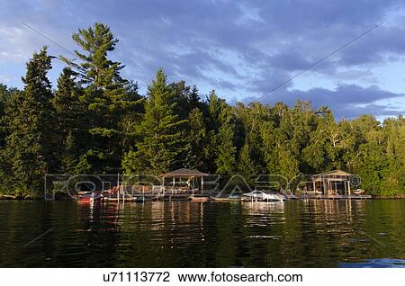 Dock at the lakeside, Lake of The Woods, Keewatin, Ontario, Canada View Large Photo Image Stock Image - Dock at the lakeside, Lake of The Woods, Keewatin, Ontario, Canada. Fotosearch