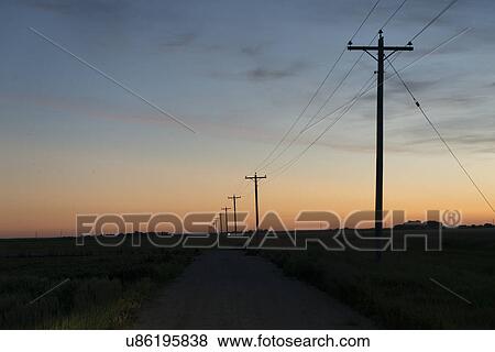 Electric cable line in a prairie field, Manitoba, Canada View Large Photo Image Stock Photo - Electric cable line in a prairie field, Manitoba, Canada. Fotosearch
