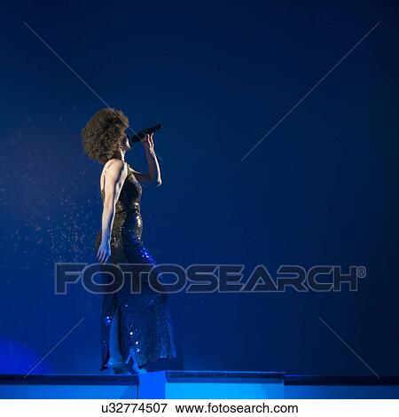 Stock Photo - Female singer performing at Dutton Family Theater, Branson, Taney County, Missouri, USA. Fotosearch