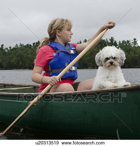 Girl boating in a lake, Lake of The Woods, Keewatin, Ontario, Canada View Large Photo Image Stock Photo - Girl boating in a lake, Lake of The Woods, Keewatin, Ontario, Canada. Fotosearch