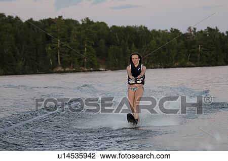 Girl waterskiing in a lake, Lake of The Woods, Keewatin, Ontario, Canada View Large Photo Image Stock Image - Girl waterskiing in a lake, Lake of The Woods, Keewatin, Ontario, Canada. Fotosearch