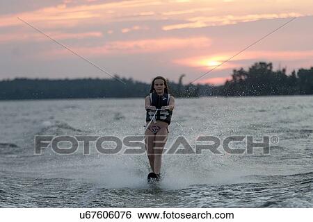 Girl waterskiing in a lake, Lake of The Woods, Keewatin, Ontario, Canada View Large Photo Image Stock Photograph - Girl waterskiing in a lake, Lake of The Woods, Keewatin, Ontario, Canada. Fotosearch