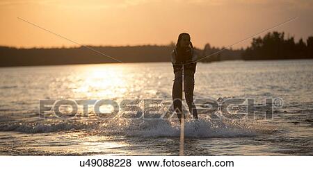 Girl waterskiing, Lake Of The Woods, Keewatin, Ontario, Canada View Large Photo Image Stock Photo - Girl waterskiing, Lake Of The Woods, Keewatin, Ontario, Canada. Fotosearch