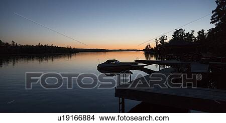 Picture - Lake at sunset, Lake Of The Woods, Keewatin, Ontario, Canada. Fotosearch