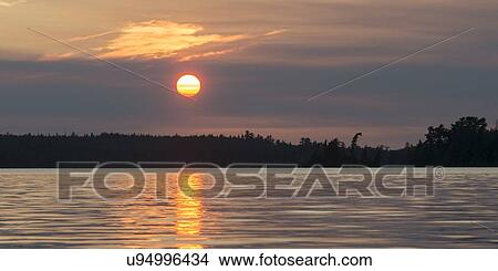 Picture - Lake at sunset, Lake Of The Woods, Keewatin, Ontario, Canada. Fotosearch