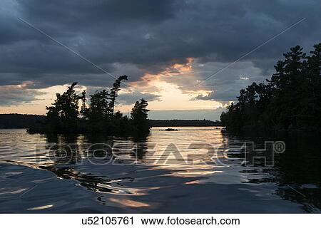 Lake at sunset, Lake of The Woods, Keewatin, Ontario, Canada View Large Photo Image Stock Image - Lake at sunset, Lake of The Woods, Keewatin, Ontario, Canada. Fotosearch