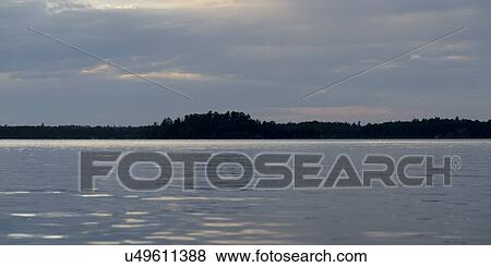 Lake at sunset, Lake Of The Woods, Keewatin, Ontario, Canada View Large Photo Image Stock Photo - Lake at sunset, Lake Of The Woods, Keewatin, Ontario, Canada. Fotosearch
