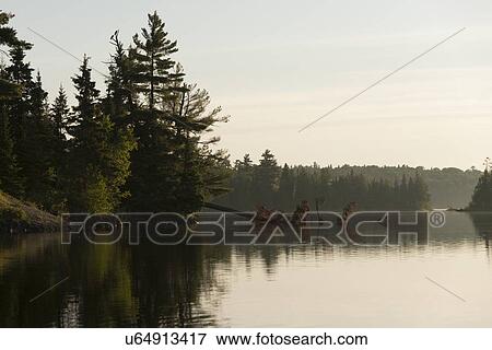 Stock Photo - Lake at sunset, Lake Of The Woods, Keewatin, Ontario, Canada. Fotosearch