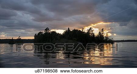 Lake at sunset, Lake Of The Woods, Keewatin, Ontario, Canada View Large Photo Image Stock Photo - Lake at sunset, Lake Of The Woods, Keewatin, Ontario, Canada. Fotosearch