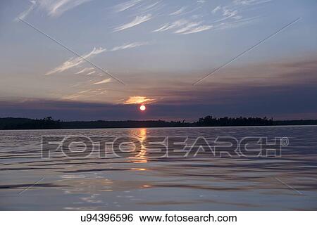 Lake at sunset, Lake of The Woods, Keewatin, Ontario, Canada View Large Photo Image Stock Photograph - Lake at sunset, Lake of The Woods, Keewatin, Ontario, Canada. Fotosearch