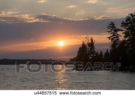 Lake at sunset, Lake of The Woods, Keewatin, Ontario, Canada View Large Photo Image Stock Photography - Lake at sunset, Lake of The Woods, Keewatin, Ontario, Canada. Fotosearch