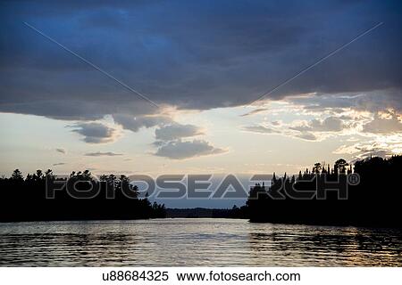 Stock Photography - Lake at sunset, Lake of The Woods, Keewatin, Ontario, Canada. Fotosearch