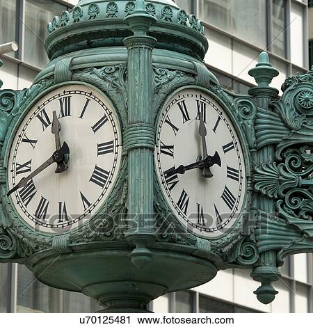 Stock Image - Low angle view of a clock on Marshall Field And Company, Chicago, Cook County, Illinois, USA. Fotosearch