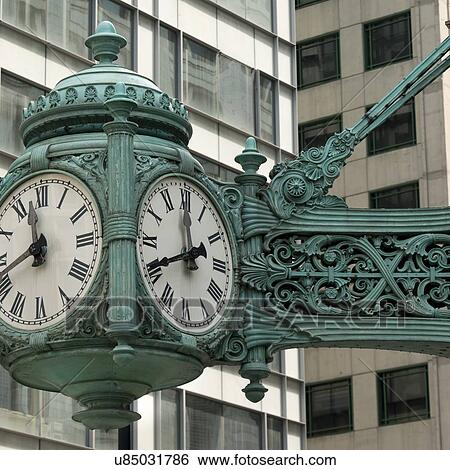 Stock Photograph - Low angle view of a clock on Marshall Field And Company, Chicago, Cook County, Illinois, USA. Fotosearch
