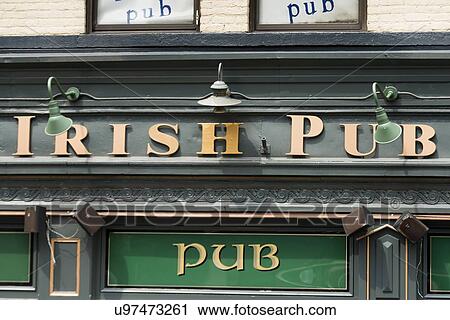 Stock Image - Low angle view of a pub and restaurant, Fado Irish Pub, Clark Street, Chicago, Cook County, Illinois, USA. Fotosearch