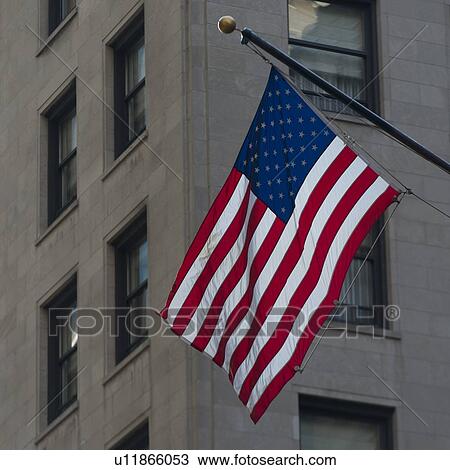 Stock Image - Low angle view of American flag, Chicago, Cook County, Illinois, USA. Fotosearch