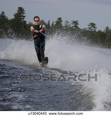 Man waterskiing in a lake, Lake of The Woods, Keewatin, Ontario, Canada View Large Photo Image Stock Image - Man waterskiing in a lake, Lake of The Woods, Keewatin, Ontario, Canada. Fotosearch