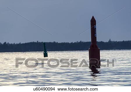Picture - Navigational buoy in a lake, Lake of The Woods, Keewatin, Ontario, Canada. Fotosearch