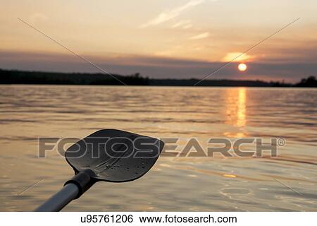 Oar in the lake at sunset, Lake of The Woods, Keewatin, Ontario, Canada View Large Photo Image Stock Photograph - Oar in the lake at sunset, Lake of The Woods, Keewatin, Ontario, Canada. Fotosearch