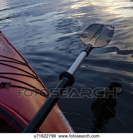 Stock Photo - Oar on the edge of a kayak, Lake of The Woods, Ontario, Canada. Fotosearch